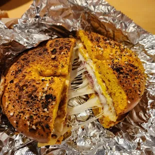 Ham and fried egg with munster cheese on a double toasted egg-everything bagel.