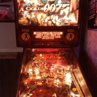 a pinball machine in a room