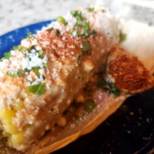 a blue plate with a piece of food on it