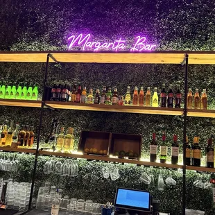 a bar with a neon sign