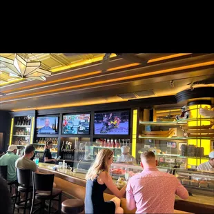 people sitting at the bar