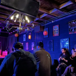 a group of people sitting at a bar