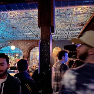 a crowd of people at a bar