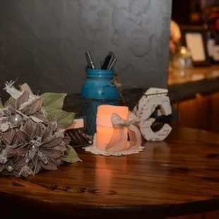 a table with a candle and decorations
