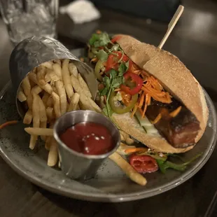 Special: Pork belly bahn mi  Crispy pork belly, general tso sauce, cucumber, pickled carrot, jalapeño, cilantro, and lime