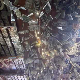 a chandelier made out of dollar bills
