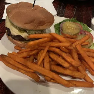 Guacamole burger with green chilis and sweet potato fries! Very generous portion!! Burger cooked perfectly