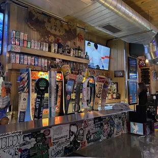 a bar with beer taps