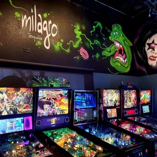 a row of pinball machines