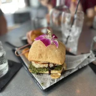 Elevated Turkey Burger with pesto and aioli sauce Yummy  along with a delicious watermelon shine drink