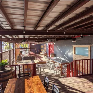 a patio with tables and chairs