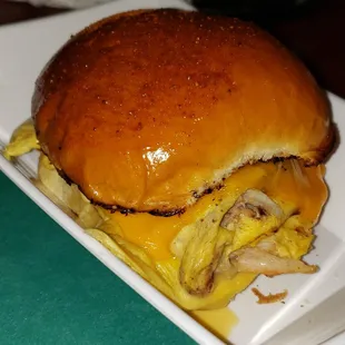 The Merlin'der -Toasted Old Bay bun (not the usual bagel), scrambled eggs, crab meat &amp; cheddar cheese.  Yum.