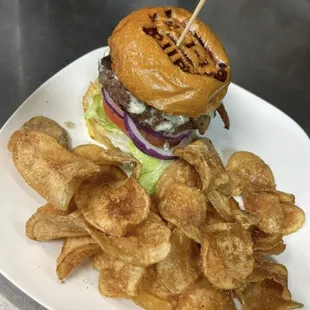 Haus Burger with Bacon served with our 411 haus chips