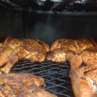 chicken cooking on the grill