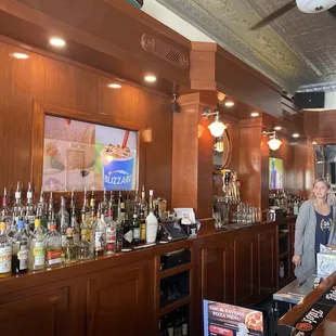 a woman behind the bar