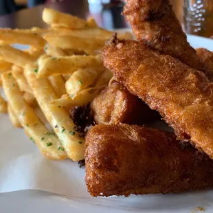 a plate of fried fish and fries