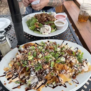 a plate of nachos on a table