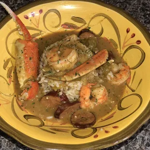Seafood Gumbo-Succulent Shrimp, snow crab, andouille sausage and okra combined in a dark roux served over white rice.