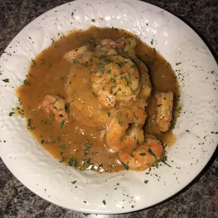 Shrimp Etouffee-Shrimp simmered in a delightful sauce of onion, bell peppers, celery and garlic served over rice.