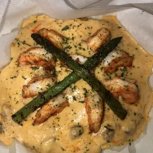 Shrimp and Grits-Cajun Shrimp or Catfish, tasso ham and garlic all spooned over a bed of creamy cheddar grits.