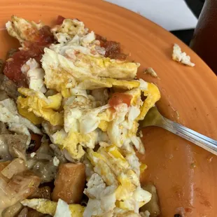 Scrambled eggs after being delivered by mistake over hard nice job of trying to reconstruct the error "NOT" .....