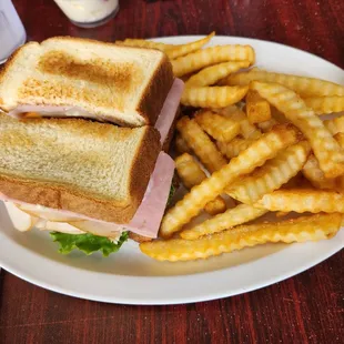 Huge Club sandwich and fries, yummy!