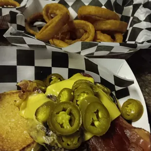 Cajun Burger and side of onion rings.