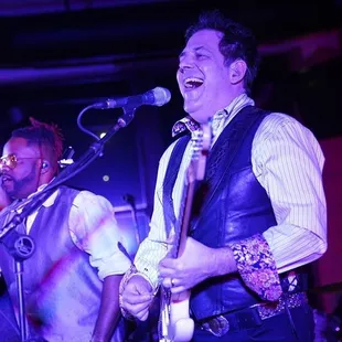 a man singing into a microphone