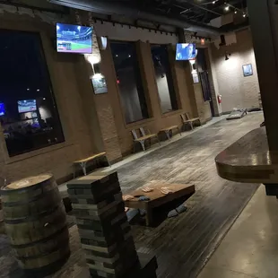 One game area with jenga and corn hole.