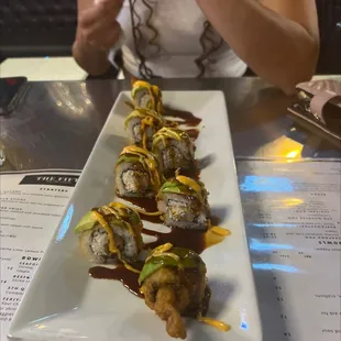 plate of sushi rolls