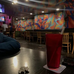 a red cup on a table in a restaurant