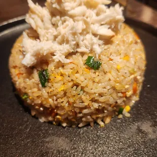 BLACK TRUFFLE FRIED RICE Savory fried rice infused with rich black truffle, onions, eggs, and carrots Shrimp $18 Crab $22