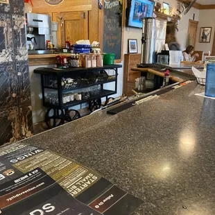 a bar with menus on the counter
