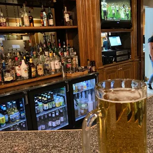 a glass of beer on the bar