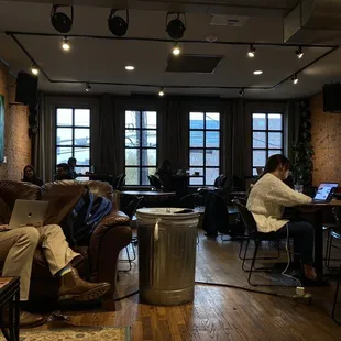 Upstairs area. Comfy couches and chairs as well as tables.