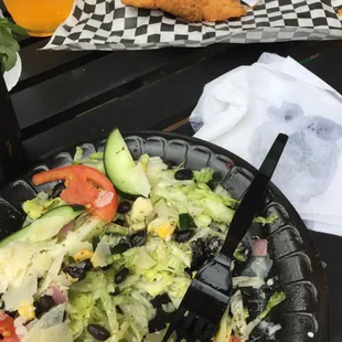 a salad with a fork in it