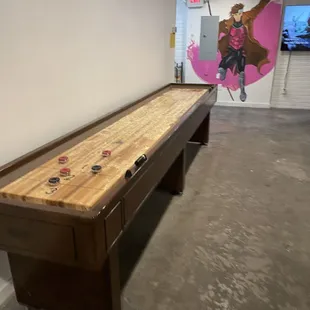 a shuffle table in the basement