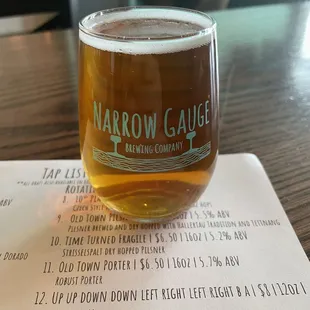 a glass of beer on a table