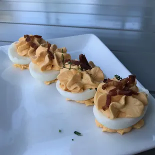 Sriracha (slightly spicy) deviled eggs with crispy bacon bits, for the egg lover!