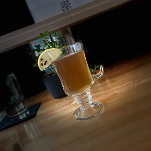 a glass of beer on a table