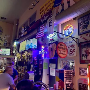 a bar filled with neon signs