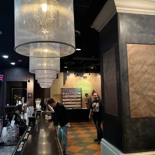 a view of a restaurant with a large chandelier