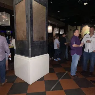 a group of people in a bar