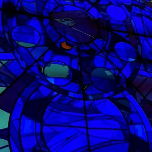 a stained glass window with a clock