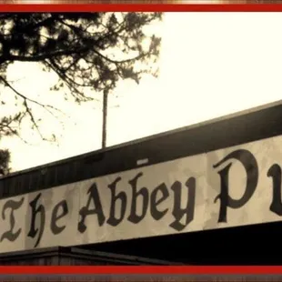 the sign for the abbey pub