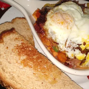 Corned beef hash with toast and eggs