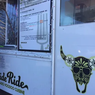 a man standing in front of a food truck