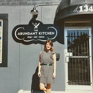 Owner Becki Melvie standing in front of Abundant Kitchen storefront. Located downtown Buffalo, MN.