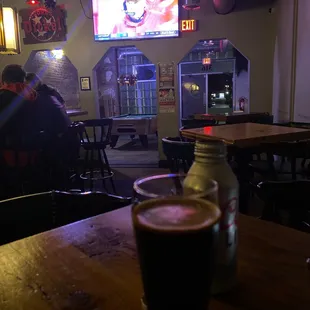 a glass of beer on a table