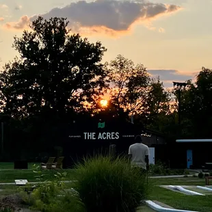 a sunset over a golf course